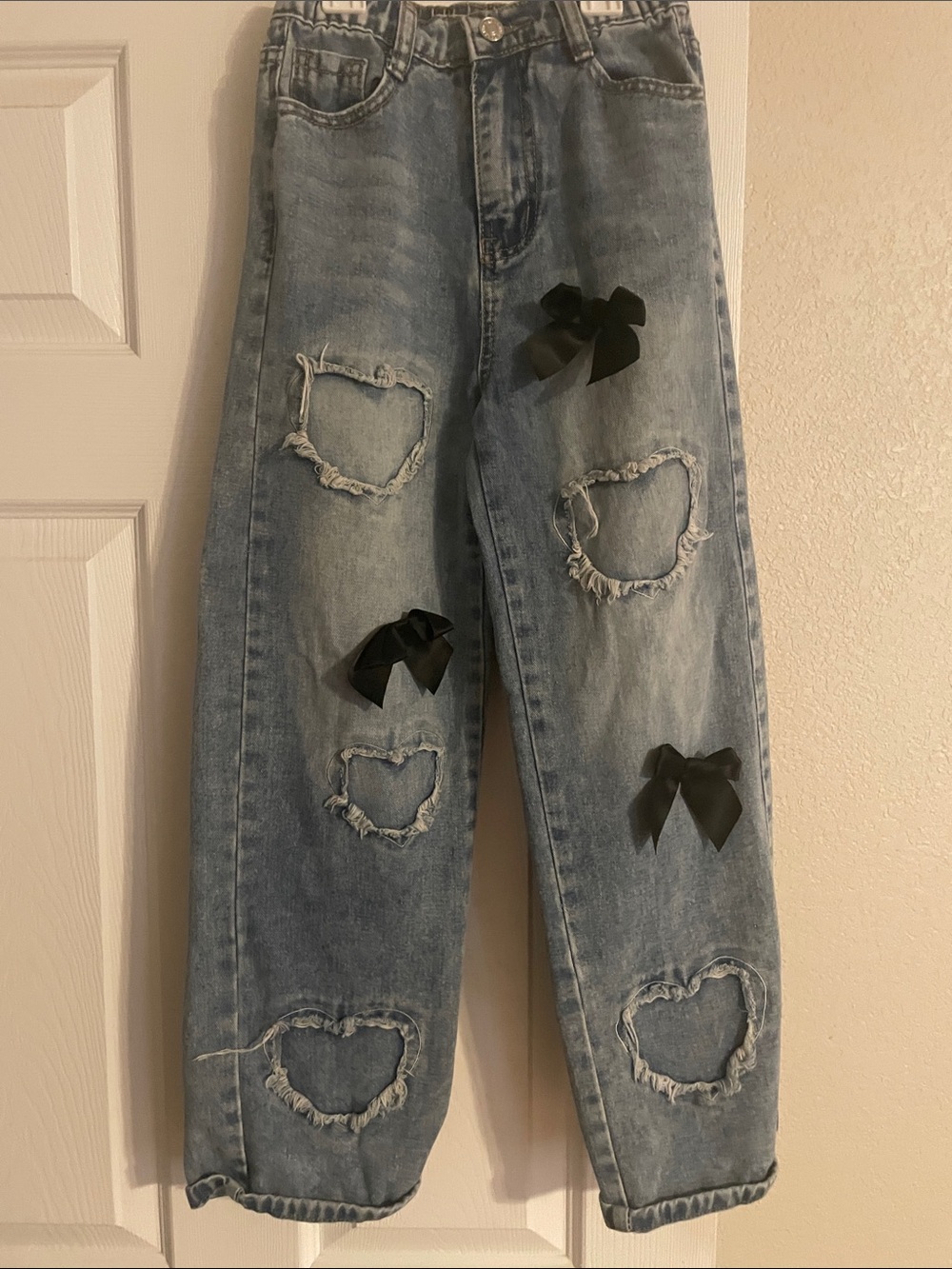 SHEIN Light Blue Distressed Heart Boyfriend Jeans with Black Bows